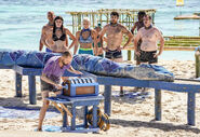 David competing in the second Immunity Challenge as his tribe watches on.