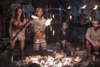 Anna and Tai lighting their torches.