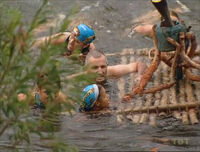 Kucha pushing their torch across the river (The Australian Outback).