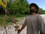 Rory breaks the Immunity Idol.