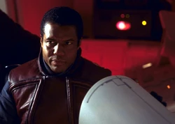 Panaka, aboard the royal starship, disagrees with the Jedi's decision to take the queen's vessel to Tatooine.
