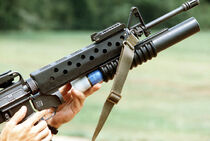 1024px-Loading M203