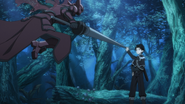 Kirito blocking a Salamander's attack.