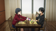 Suguha showing BoB news article to Kazuto