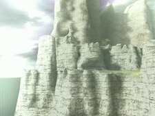 Cliff edge with a pillar-like rock formation.