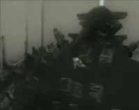 On top of Knight. Note the metallic plates placed on the arena. Broken pieces of its armor can also be seen on the ground.