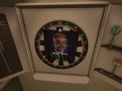 A picture of Sergio Venturi on the dartboard in Administration.