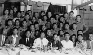 Nam Tae Hi, fourth from left on the bottom row, sits next to Choi Hong Hi, fifth from left.