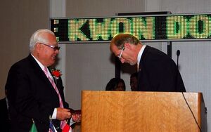 Nam Tae Hi, left, being inducted into the Taekwondo Hall of Fame in 2007