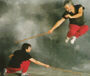 Maurice Sarry (right) practicing canne de combat.