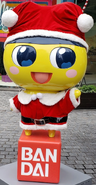 The Mametchi statue in a Santa outfit