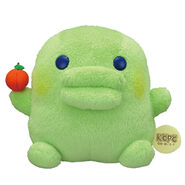 A Kuchipatchi plush with an apple