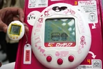 Lotteria Deka Tamagotchi at a press conference.