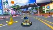 Mametchi taking on the Wario Cup's challenge; driving backward while dodging Banana Peels.