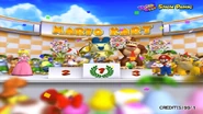 Mametchi on the podium alongside Toad, Donkey Kong, Princess Peach, Mario, and Bowser, having won 1st place.