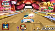 Mametchi racing in his Special Kart on Yoshi Park 2, with the Boo item at hand.
