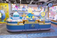 TamagotchiFactory Inside5.webp (125 KB) Center display with animated screens in background