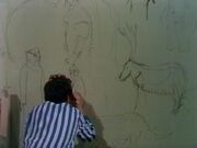 A maddened Spencer draws  and other prehistoric creatures.
