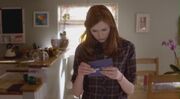 Amy opens the TARDIS blue envelope.