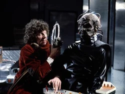 The Fourth Doctor struggles with Davros.