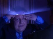 The aliens unzip their heads.