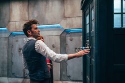 The Doctor and Donna observe the TARDIS.
