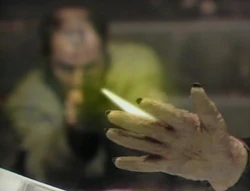 Bostock shoots Davros's hand.