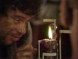  keenly watches his candle burn lower