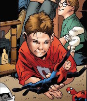 Child with Captain Britain and Spider-Man toys