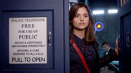 Clara looks out of TARDIS