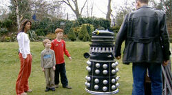 The Doctor arrives at the Blue Peter garden after searching throughout time and space for the Dalek compost bin.