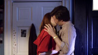 The Doctor and Amy kiss