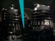 The Supreme's Daleks engage the first of the "gold sphere Daleks" on Necros
