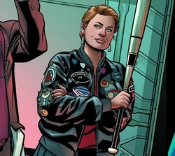 Ace wearing her jacket, decorated in several patches and pins