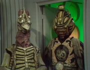  next to his creator.