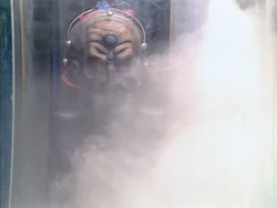Davros is overwhelmed by a white vapour as the cryogenic freezer activates.