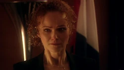 Goddard watches the confrontation between Van Statten and the Metaltron.