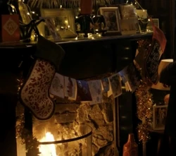 Two Christmas stockings hanging over a 