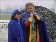 Peri and Sixth Doctor arrive at Tranquil Repose