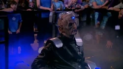 Davros emerges from the time corridor.