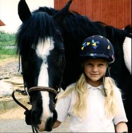 Young Taylor with her horse