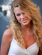 Taylor-swift smile look down white dress