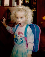 Taylor Swift young child, curly hair and surprised face