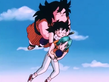 Gohan carries Yajirobe, Bulma and Trunks