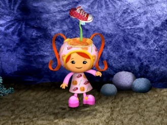 Milli putting silly things on her head