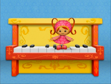 Milli and the piano.png