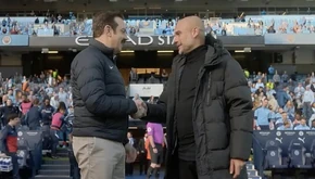 Ted and Pep shake hands after the match