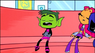 A rock hits Beast Boy's head, finally waking him up.