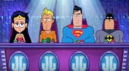 Wonder Woman, Aquaman, Superman and Batman as judges in "Justice League's Next Top Talent Idol Star".