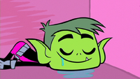 Beast Boy sleeping in his coffin.